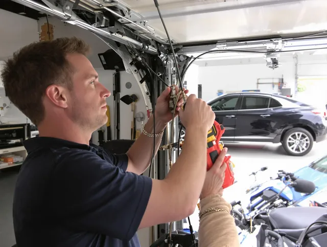 Rehoboth Garage Door Repair safety certified technician performing cable replacement in Rehoboth