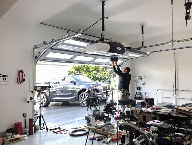 Rehoboth Garage Door Repair specialist installing smart garage door opener system in Rehoboth home